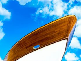 Low-angle Photography of White and Brown Boat Under Cloudy Sky