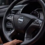 Close-Up Shot of a Person Driving a Car