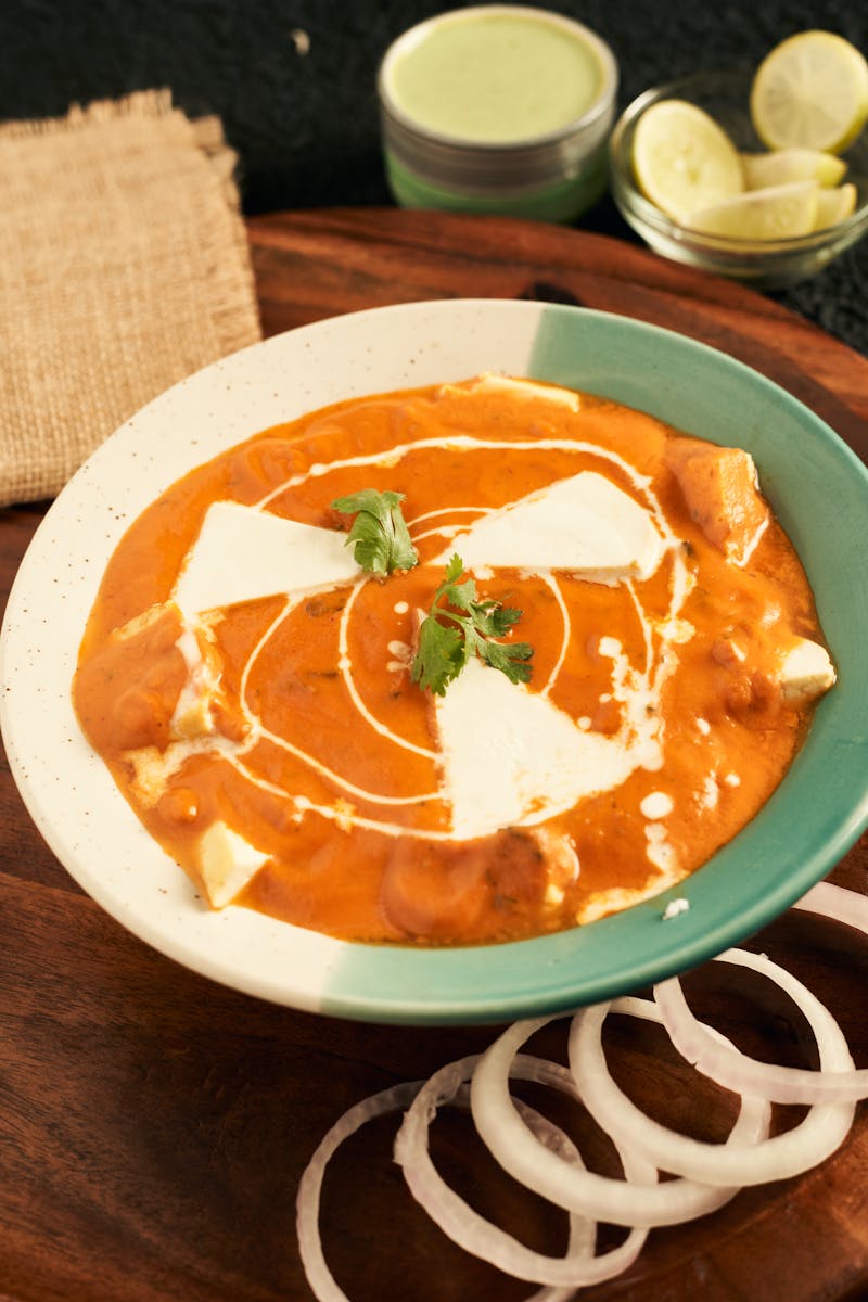 Food in a Ceramic Bowl on a Wooden Board