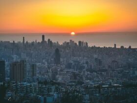 city skyline during sunset with orange sky